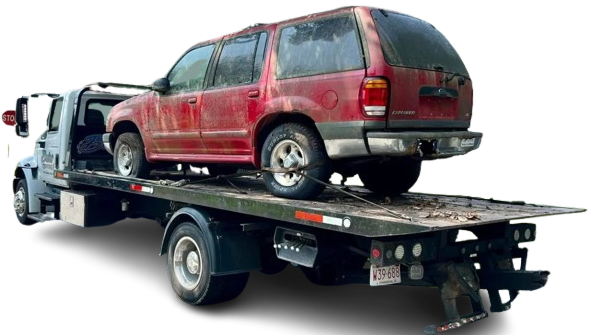 Tow truck loading a red car